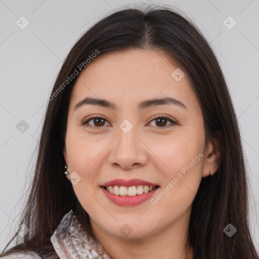 Joyful white young-adult female with long  brown hair and brown eyes