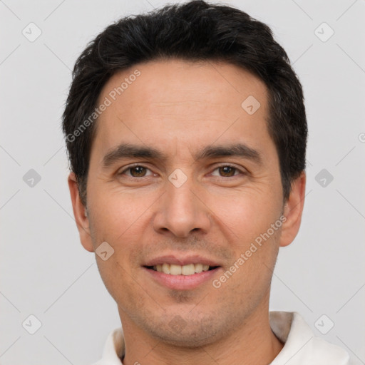 Joyful white young-adult male with short  black hair and brown eyes