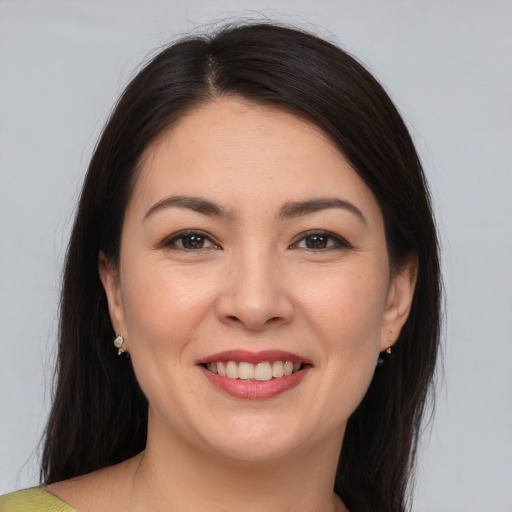 Joyful white young-adult female with medium  brown hair and brown eyes