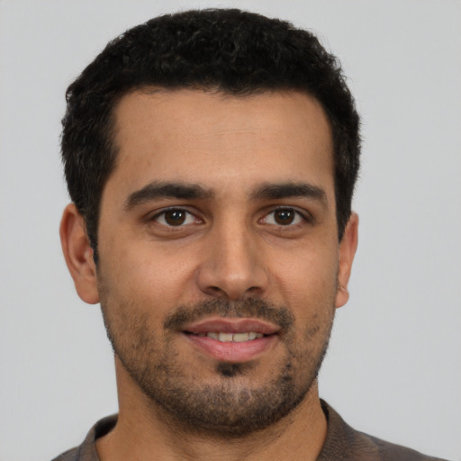 Neutral latino young-adult male with short  brown hair and brown eyes