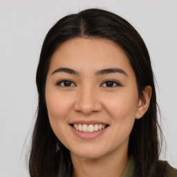 Joyful asian young-adult female with long  brown hair and brown eyes