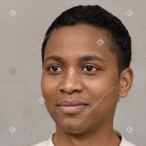 Joyful black young-adult female with short  black hair and brown eyes