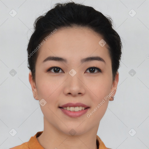 Joyful asian young-adult female with short  black hair and brown eyes