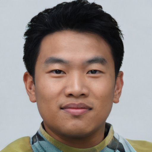 Joyful asian young-adult male with short  black hair and brown eyes
