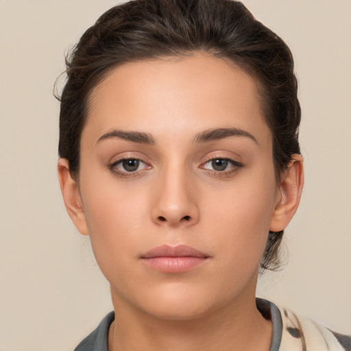 Neutral white young-adult female with medium  brown hair and brown eyes