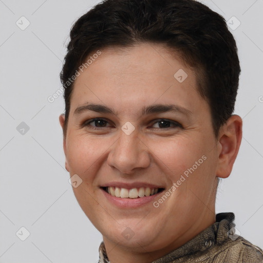 Joyful white young-adult female with short  brown hair and brown eyes