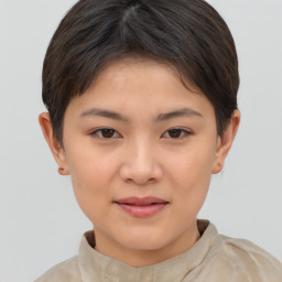 Joyful white child female with short  brown hair and brown eyes