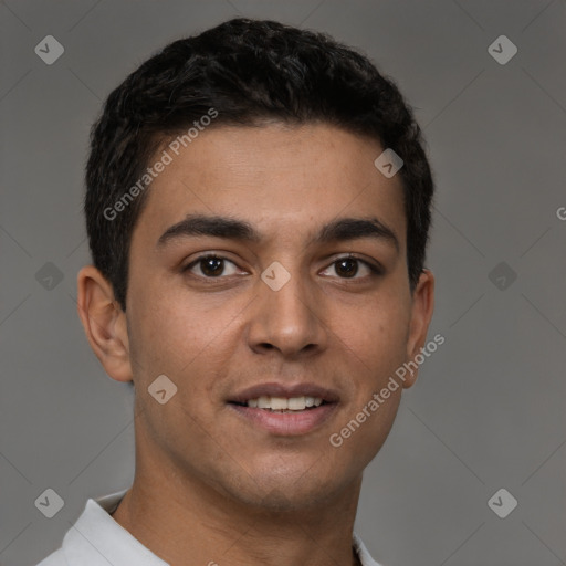 Joyful latino young-adult male with short  brown hair and brown eyes