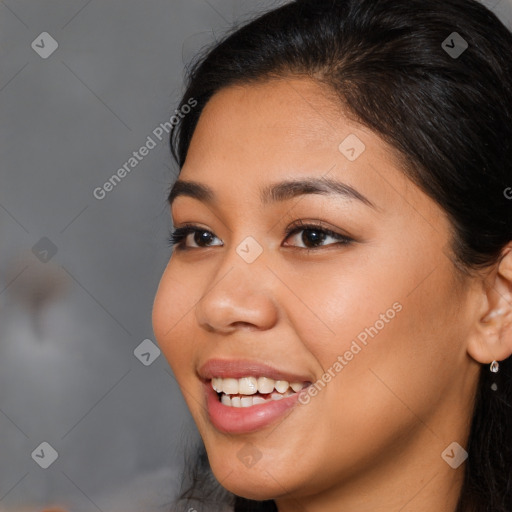 Joyful latino young-adult female with long  brown hair and brown eyes