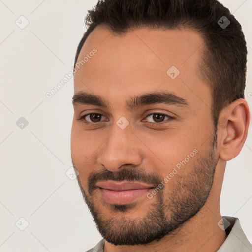 Joyful white young-adult male with short  brown hair and brown eyes