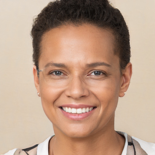 Joyful white young-adult female with short  brown hair and brown eyes