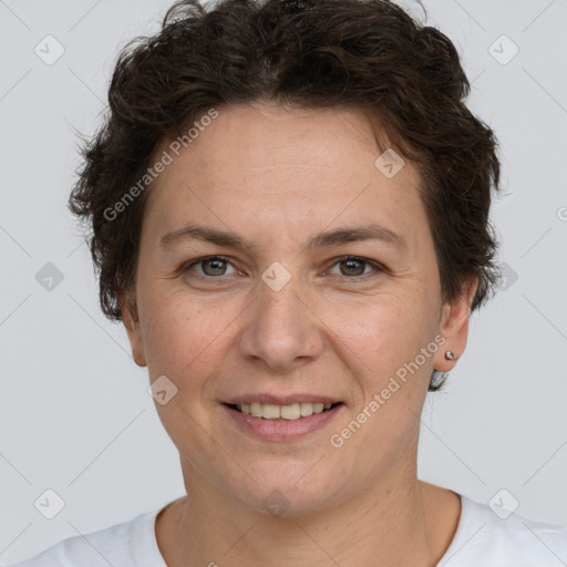 Joyful white adult female with short  brown hair and brown eyes