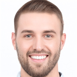 Joyful white young-adult male with short  brown hair and brown eyes