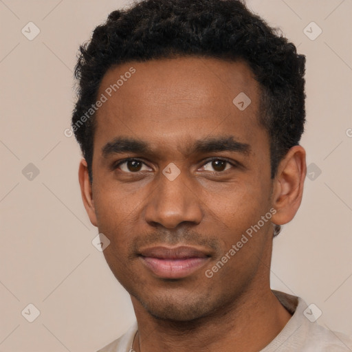 Joyful black young-adult male with short  black hair and brown eyes