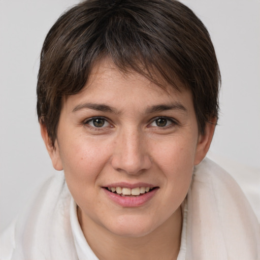 Joyful white young-adult female with medium  brown hair and brown eyes