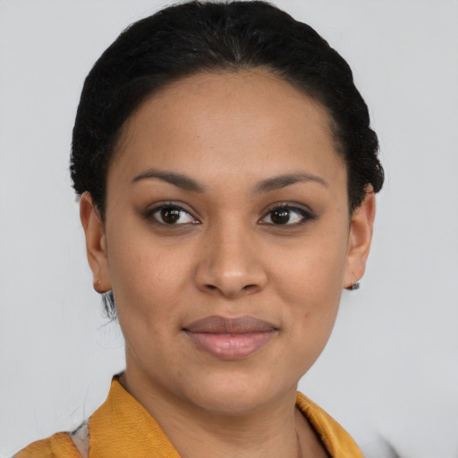 Joyful latino young-adult female with short  brown hair and brown eyes