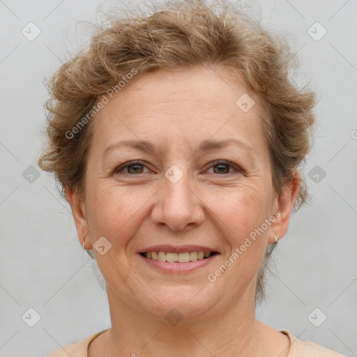 Joyful white adult female with short  brown hair and brown eyes