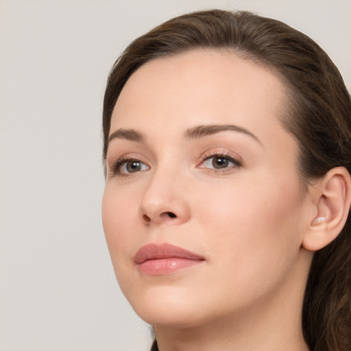 Neutral white young-adult female with medium  brown hair and brown eyes