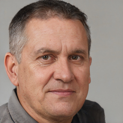 Joyful white middle-aged male with short  brown hair and brown eyes