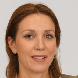 Joyful white adult female with medium  brown hair and grey eyes