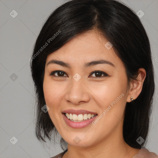 Joyful asian young-adult female with medium  brown hair and brown eyes