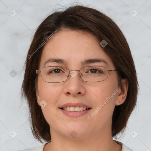 Joyful white adult female with medium  brown hair and brown eyes