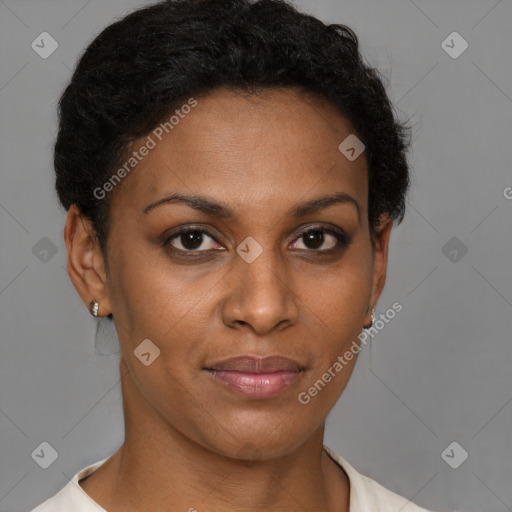 Joyful black adult female with short  brown hair and brown eyes