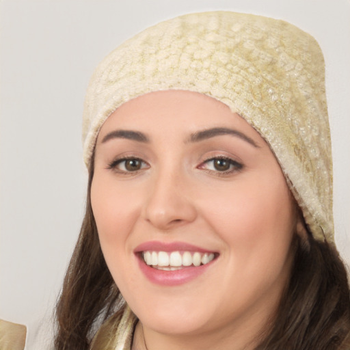 Joyful white young-adult female with long  black hair and brown eyes