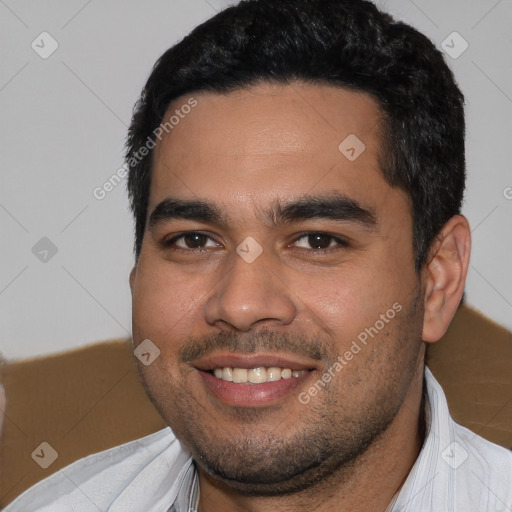 Joyful white young-adult male with short  black hair and brown eyes