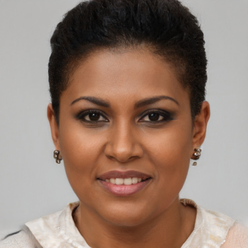 Joyful black young-adult female with short  brown hair and brown eyes