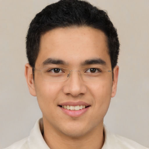 Joyful latino young-adult male with short  brown hair and brown eyes