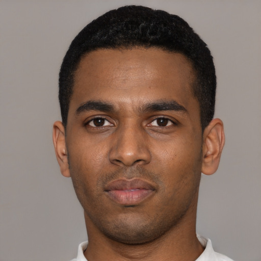 Neutral black young-adult male with short  black hair and brown eyes