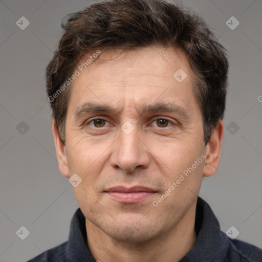 Joyful white adult male with short  brown hair and brown eyes