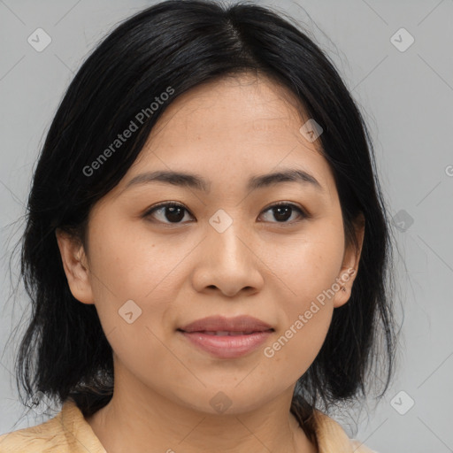 Joyful asian young-adult female with medium  black hair and brown eyes