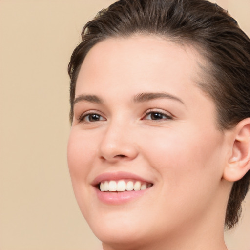 Joyful white young-adult female with medium  brown hair and brown eyes