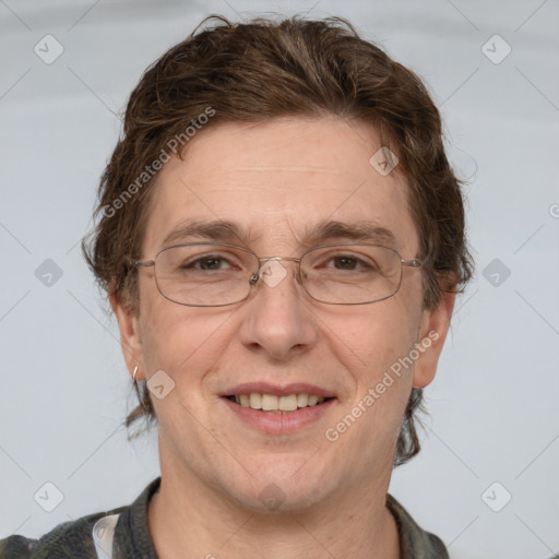 Joyful white adult male with short  brown hair and grey eyes