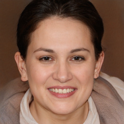 Joyful white young-adult female with medium  brown hair and brown eyes