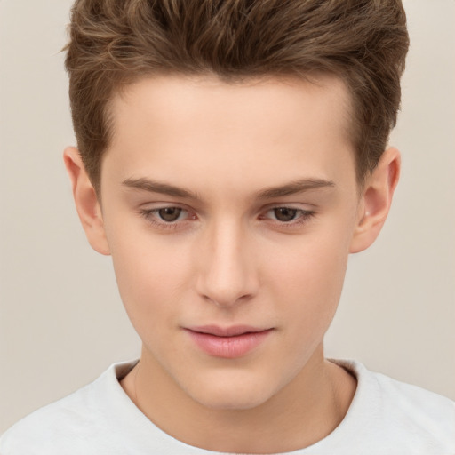 Joyful white child male with short  brown hair and brown eyes