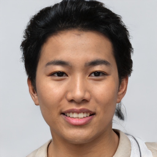 Joyful asian young-adult male with short  black hair and brown eyes