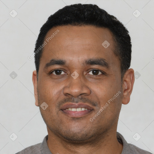 Neutral latino young-adult male with short  black hair and brown eyes