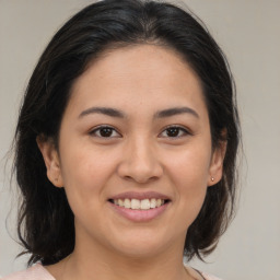 Joyful white young-adult female with medium  brown hair and brown eyes