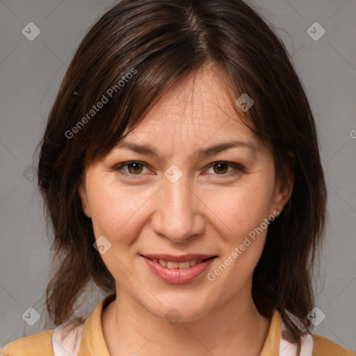 Joyful white adult female with medium  brown hair and brown eyes