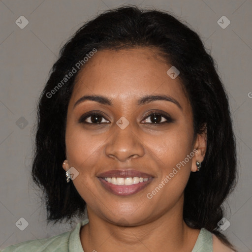 Joyful black young-adult female with medium  brown hair and brown eyes