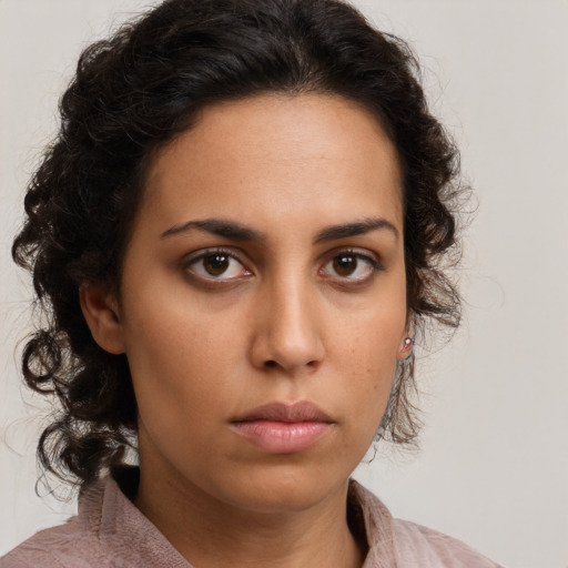 Neutral latino young-adult female with medium  brown hair and brown eyes
