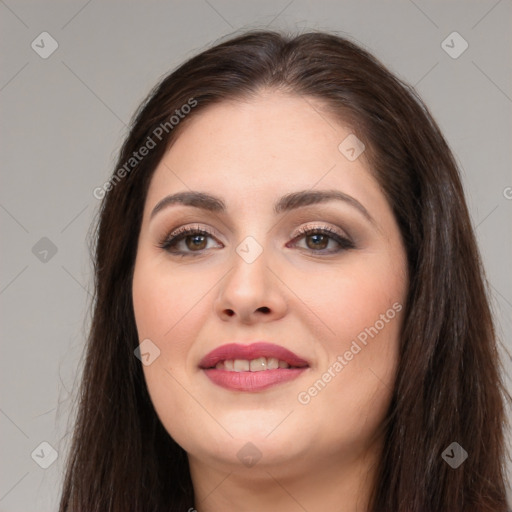 Joyful white young-adult female with long  brown hair and brown eyes