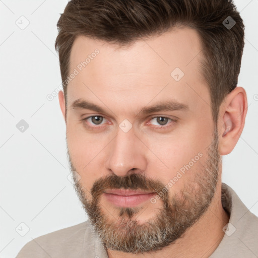 Neutral white young-adult male with short  brown hair and brown eyes