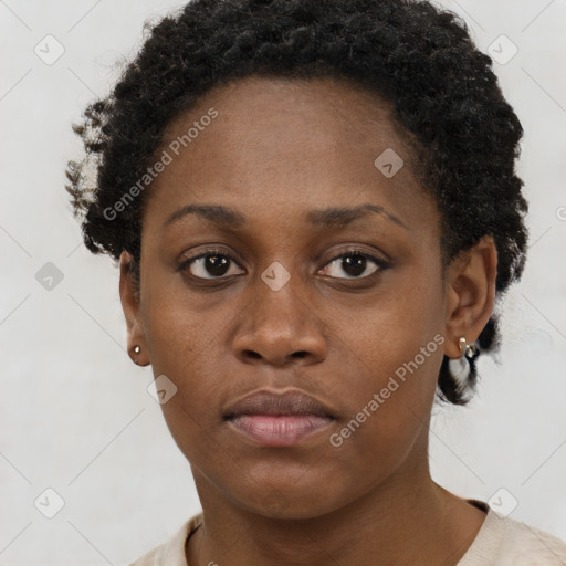 Neutral black young-adult female with short  brown hair and brown eyes