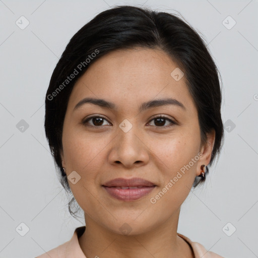 Joyful latino young-adult female with medium  brown hair and brown eyes