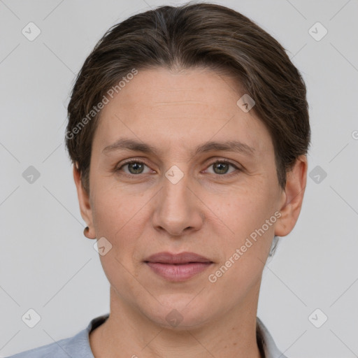 Joyful white adult female with short  brown hair and grey eyes