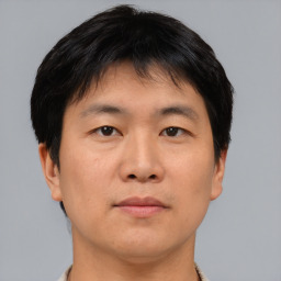 Neutral asian young-adult male with short  brown hair and brown eyes